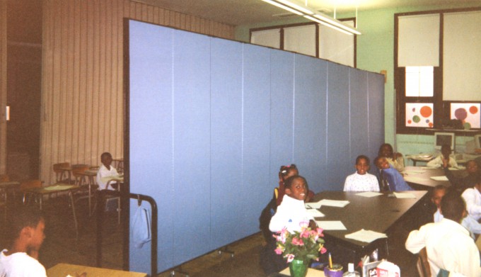 Acoustical Wallmount dividers help make the best use of space in crowded schools