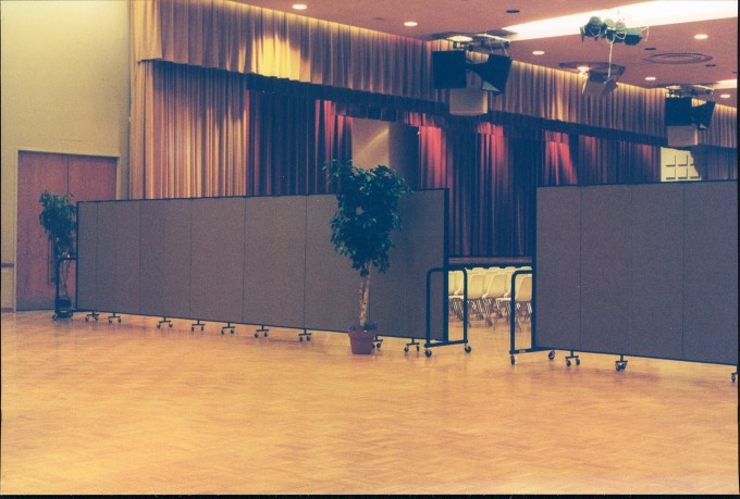 Portable dividers were easily rolled from the library to the auditorium to help create a more intimate setting for graduation