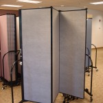 A patially opened Screenflex room divider