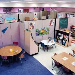 A school converts a large open space into multiple classrooms with Screenflex Room Dividers