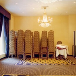 stackable ballroom chairs along a banquet room