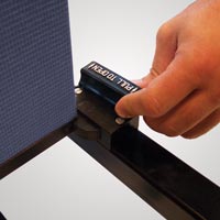 Hand releasing a storage latch on a Screenflex Room Divider