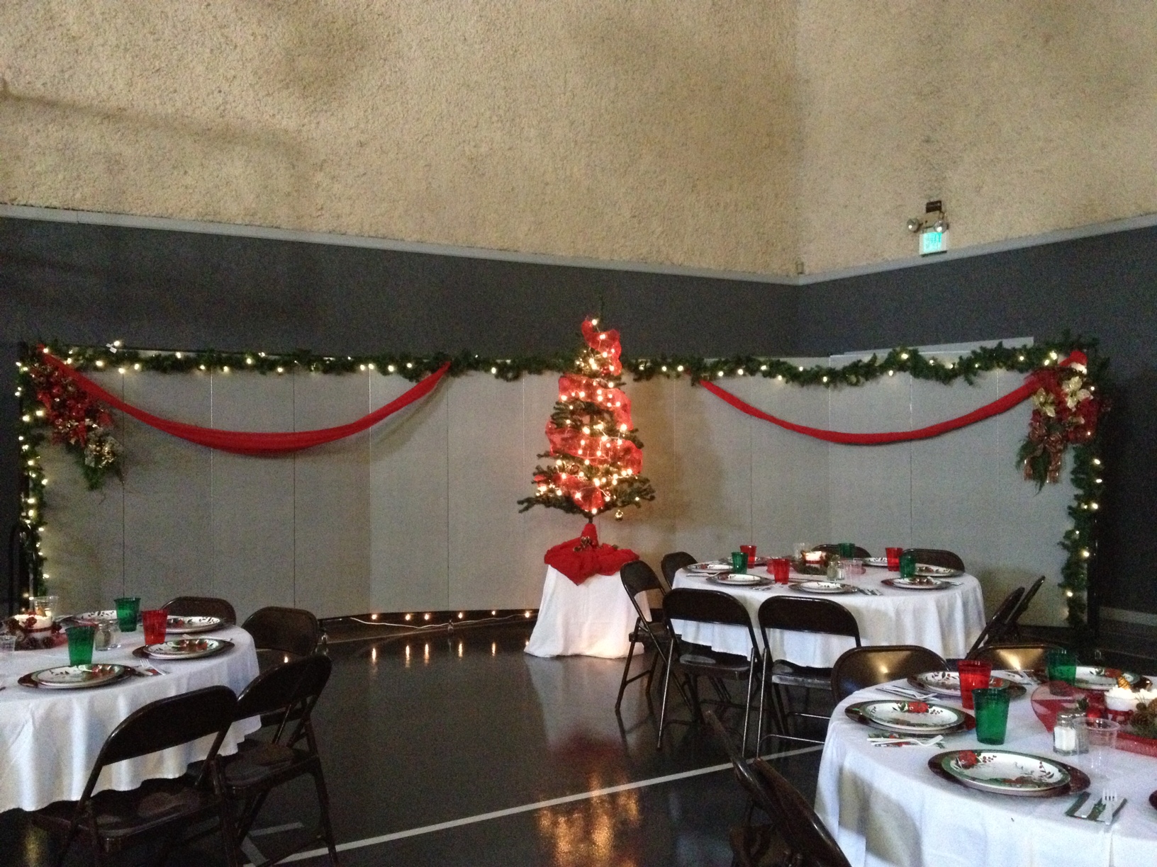 Decorated church gym for a women's Christmas banquet