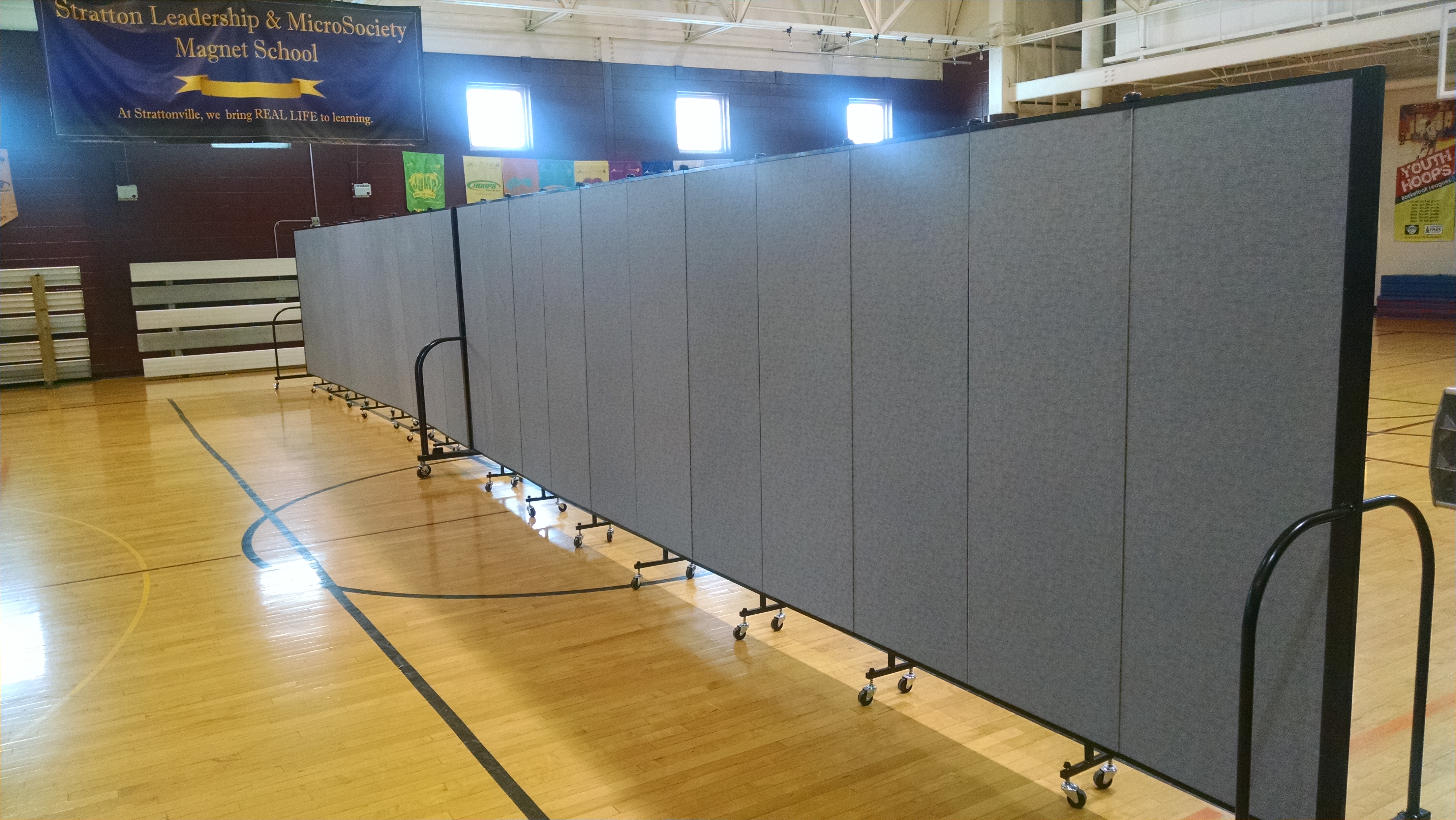 Dividing a gym into two with a portable room divider